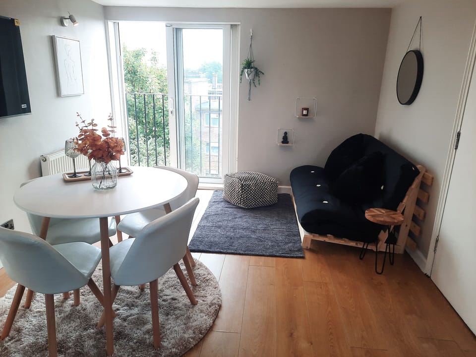 Quadruple Room, 1 Double Bed with Sofa bed, City View | Living area | TV