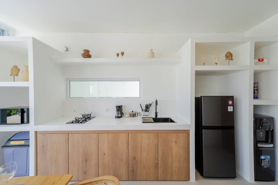 Fridge, coffee/tea maker, paper towels, kitchen islands
