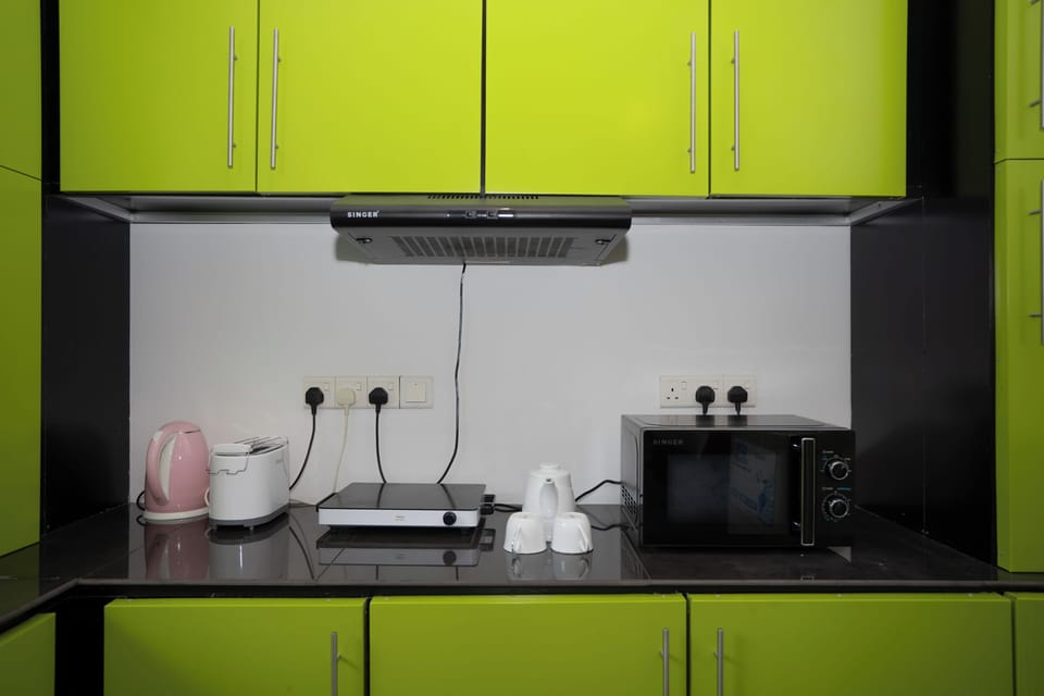 Deluxe Studio, Balcony | Private kitchen | Mini-fridge, microwave, oven, dishwasher