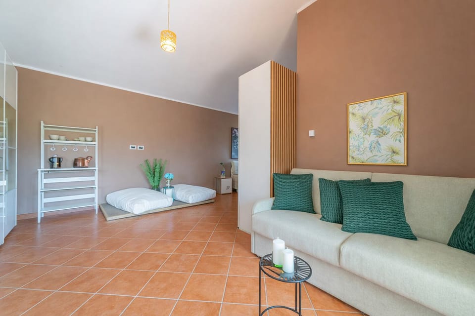 Suite, Patio | Living area | Flat-screen TV