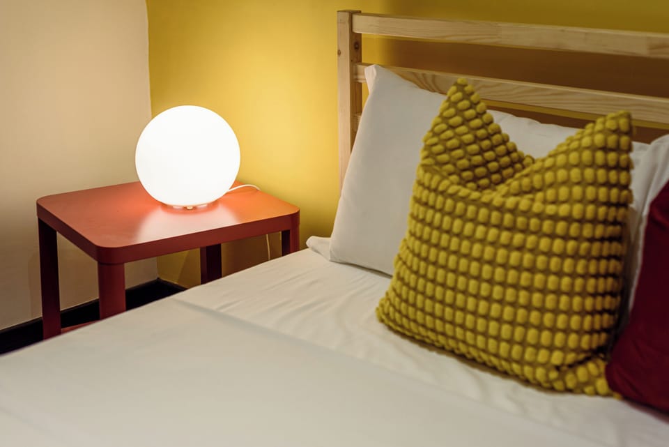 Apartment (0 Bedroom) | Laptop workspace, bed sheets