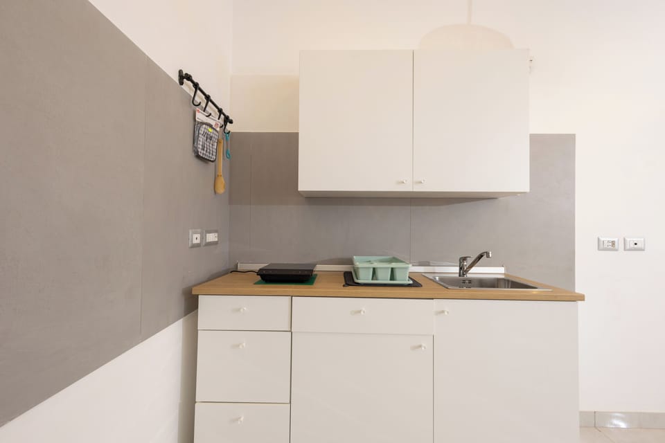 Apartment (2 Bedrooms) | Private kitchen | Espresso maker, stovetop, cookware/dishes/utensils, dining table
