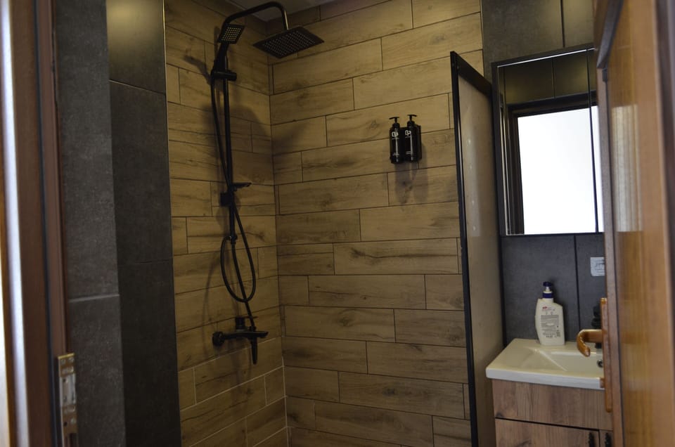 Family Room, Multiple Beds, Lake View | Bathroom | Shower, hair dryer, slippers, towels