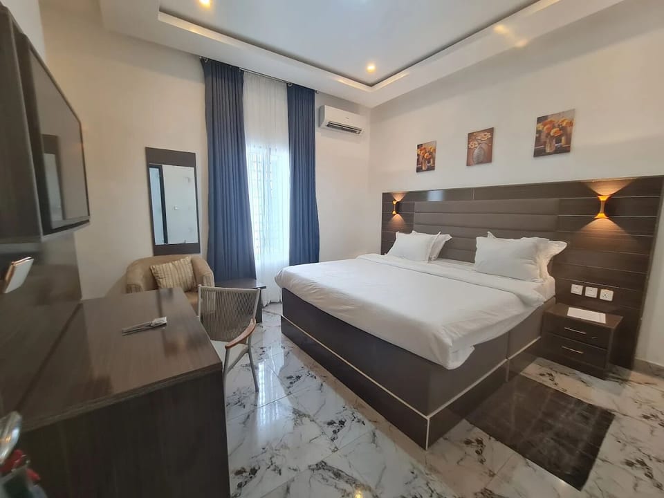 Deluxe Room, Balcony, City View | Desk, laptop workspace, blackout drapes, soundproofing