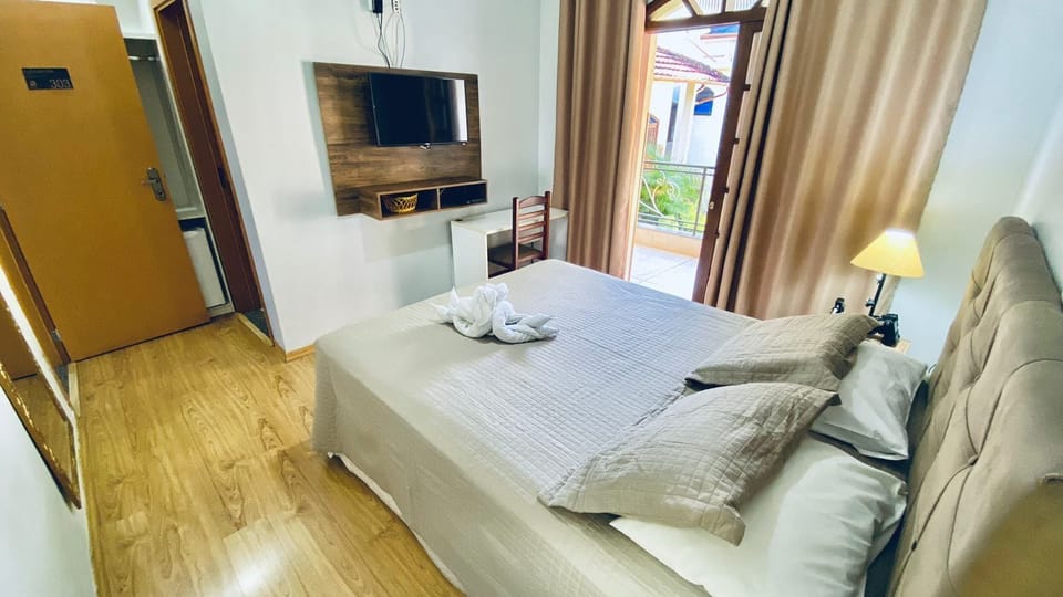 Double Room | Minibar, desk, blackout drapes, iron/ironing board