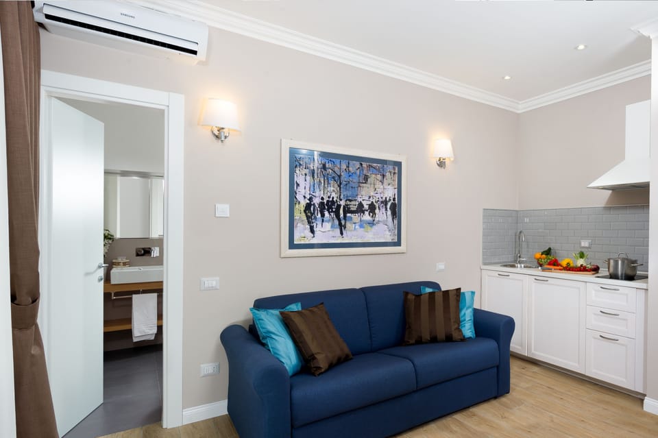 Family Junior Suite  | Living area | 42-inch flat-screen TV with digital channels, TV