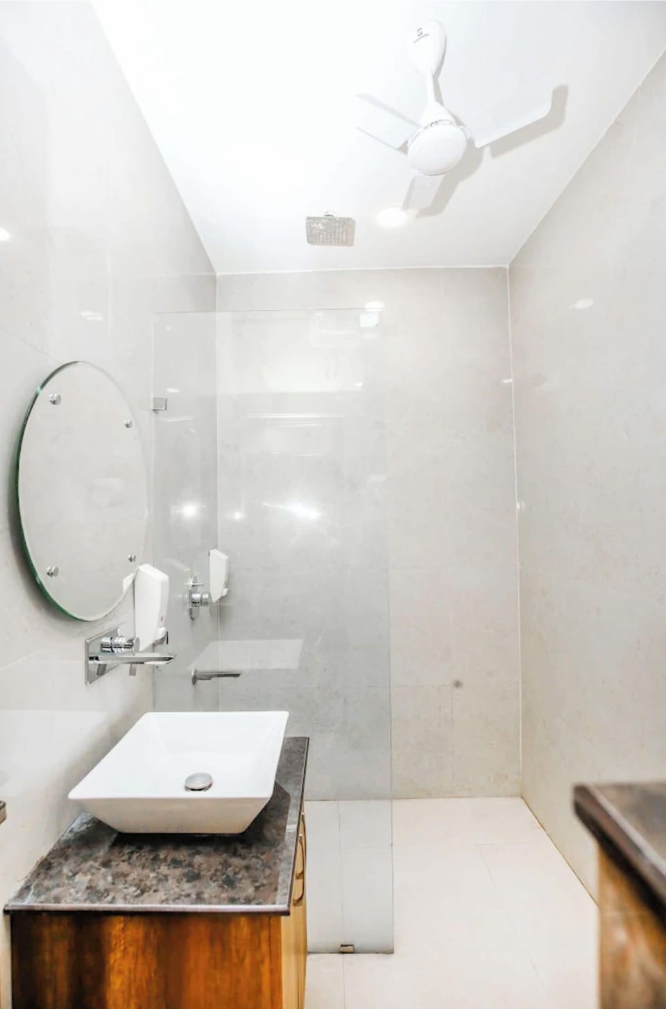 Shower, rainfall showerhead, slippers, towels
