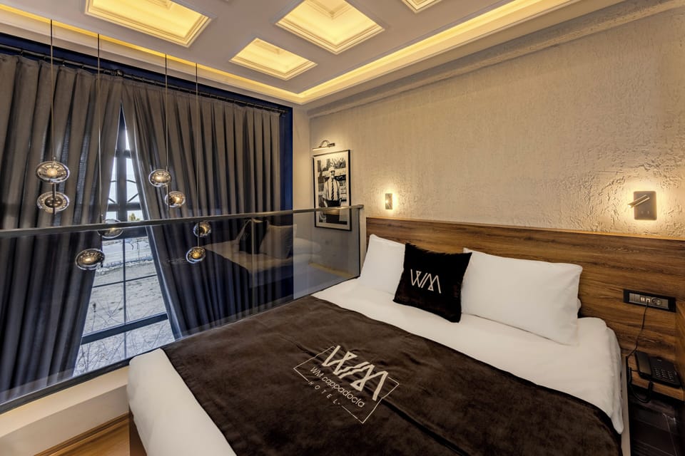 Deluxe Suite, Garden View | Premium bedding, minibar, blackout drapes, soundproofing