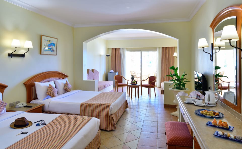 Family Room | Minibar, in-room safe, laptop workspace, blackout drapes