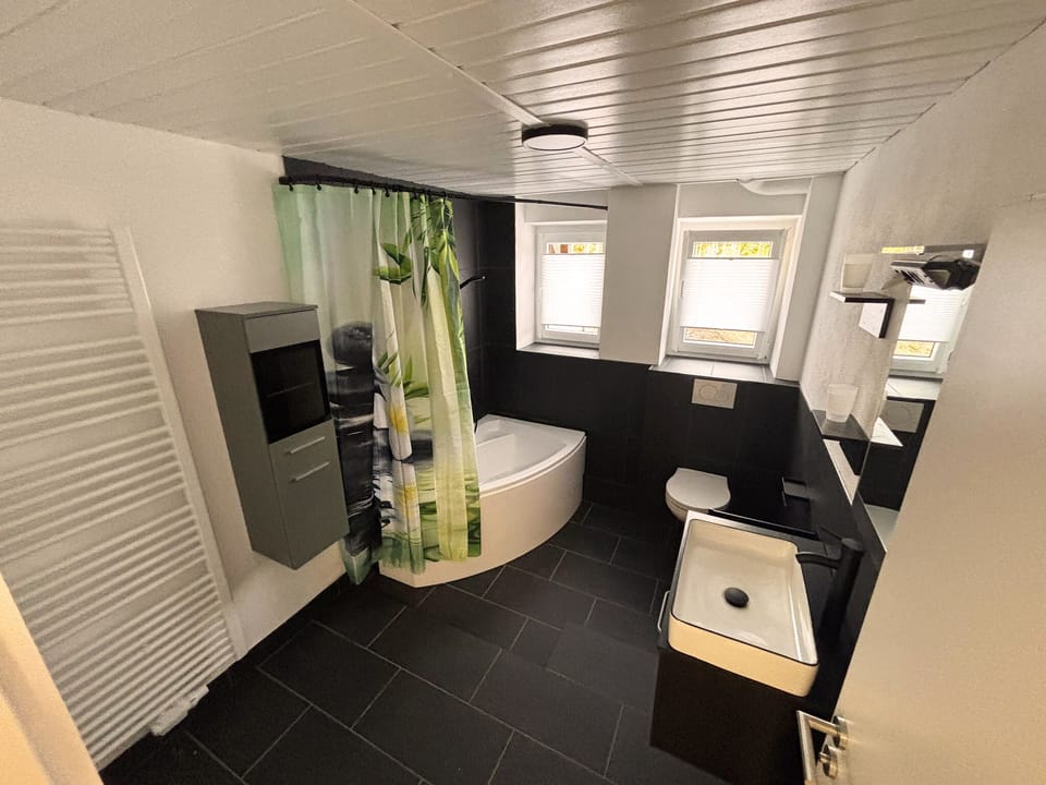 Deluxe Apartment, Resort View | Bathroom | Hair dryer, towels, soap, shampoo