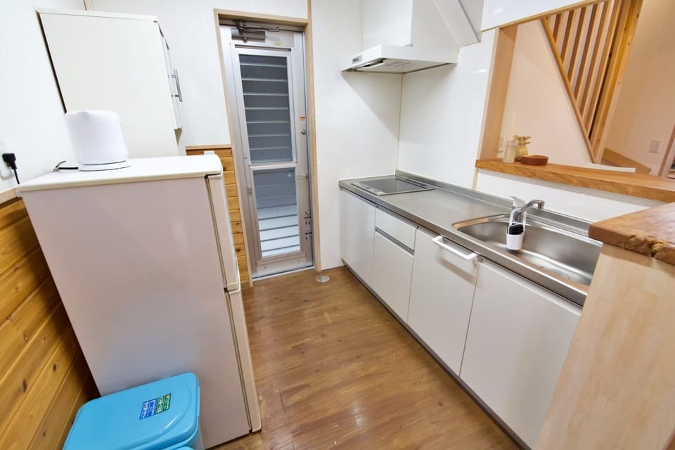 Apartment | Private kitchen | Full-size fridge, stovetop, rice cooker, cookware/dishes/utensils