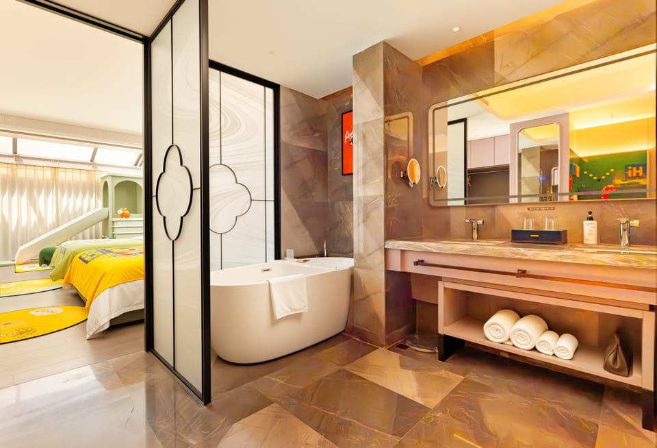 Themed Family Room | Bathroom | Hair dryer, towels, soap, shampoo