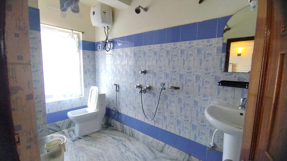 Shower, rainfall showerhead, towels, soap