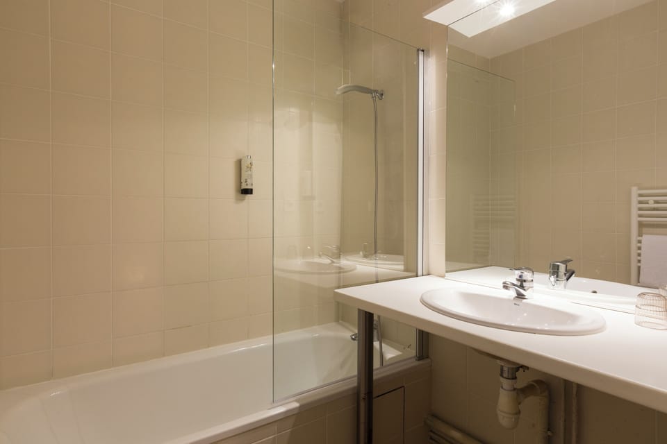 Bathtub, hair dryer, towels, soap