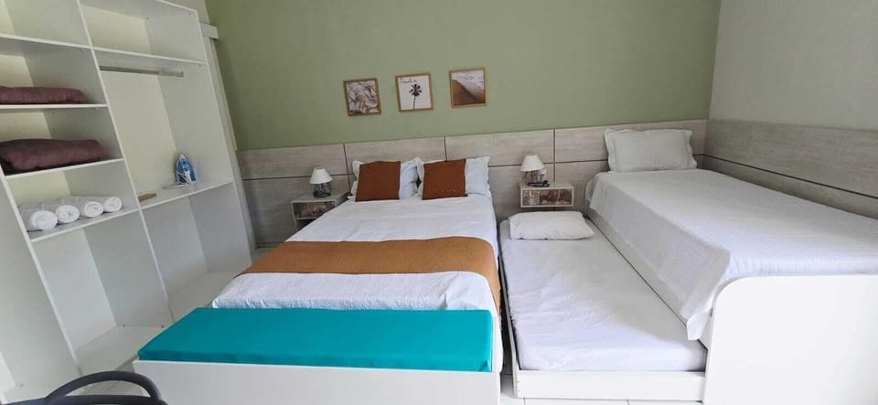 Family Room, Garden View | Blackout drapes, iron/ironing board, free WiFi
