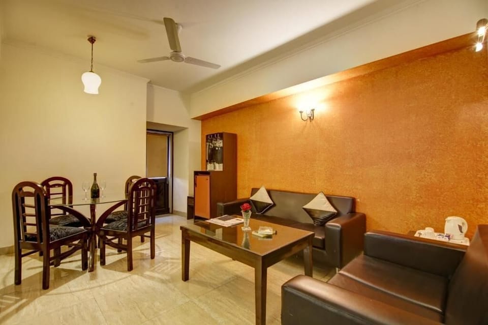 Luxury Studio Suite, Balcony, City View | Living area | TV