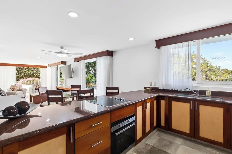 Apartment, Multiple Beds, Pool Access, Partial Ocean View (Grand Miramar B103) | Private kitchen