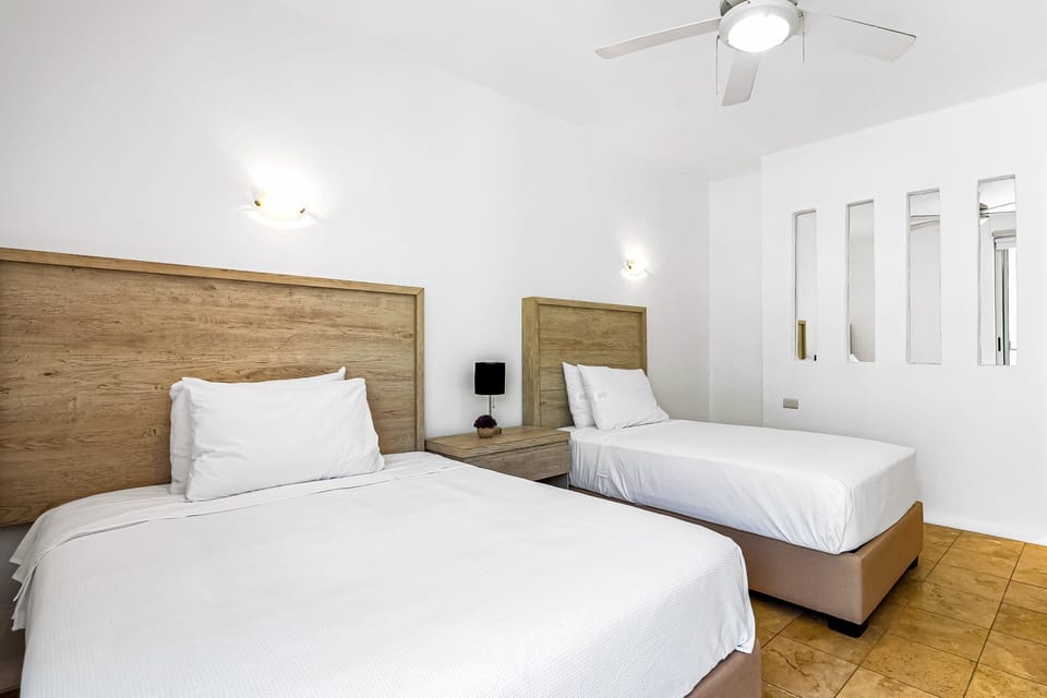 Condo, Multiple Beds, Pool Access, Beach View (Nitta Condo # 308) | 2 bedrooms, individually decorated, individually furnished, bed sheets
