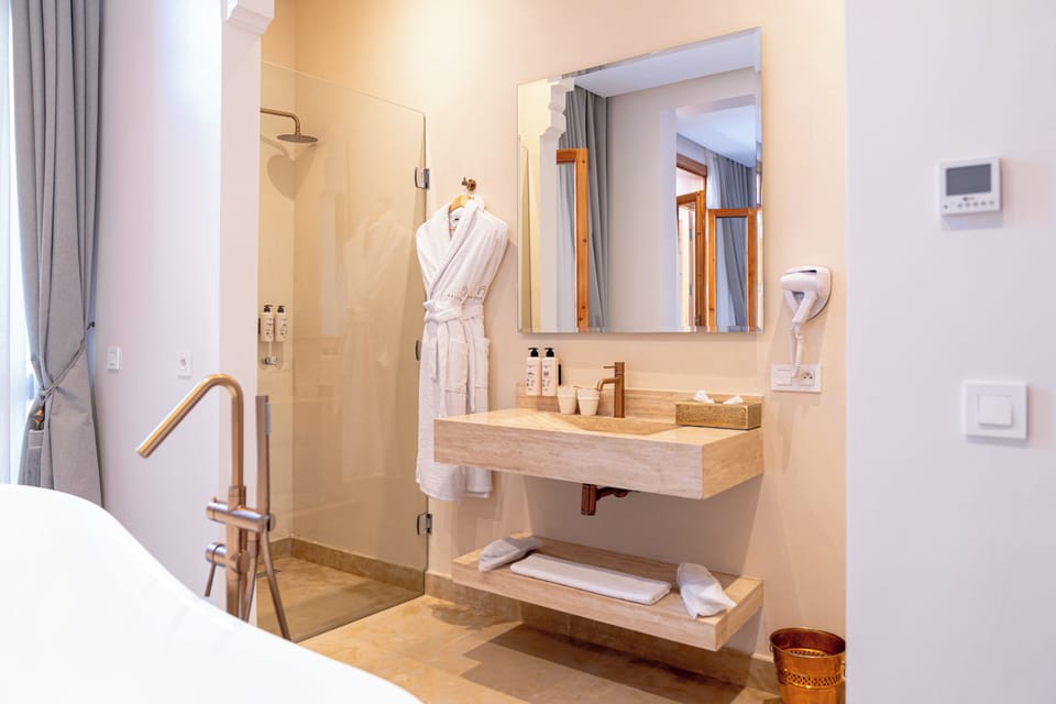 Royal Suite, Balcony, City View | Bathroom | Hair dryer, slippers, towels, soap