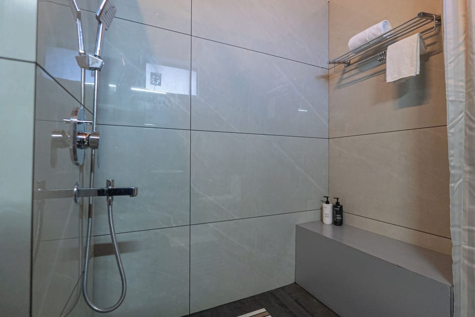 Luxury Apartment | Bathroom | Shower, towels, soap, shampoo