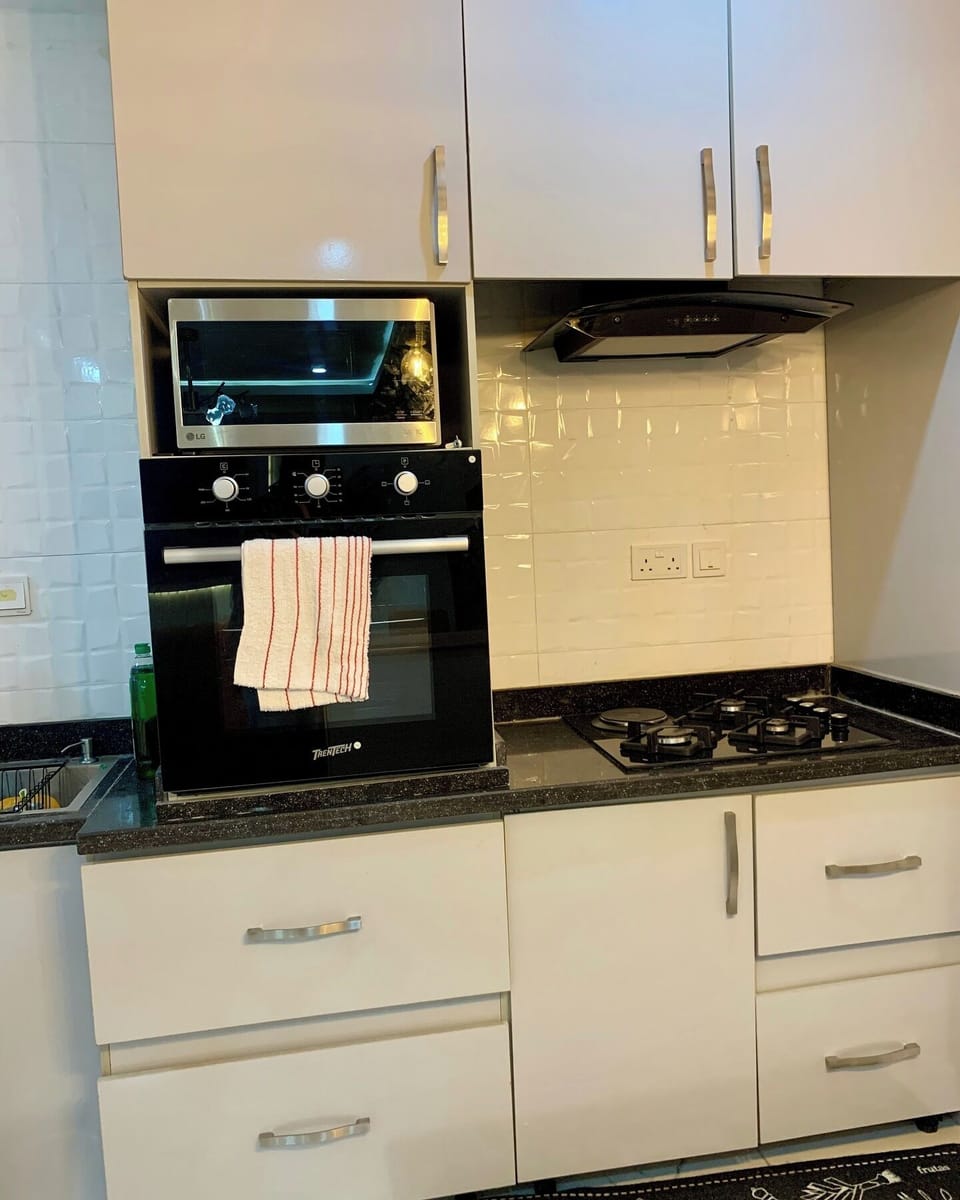 Family Room, Balcony, City View | Private kitchen