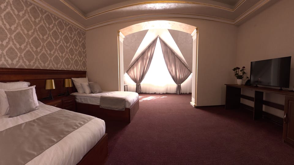 Deluxe Twin Room, City View | In-room safe, desk, soundproofing, iron/ironing board