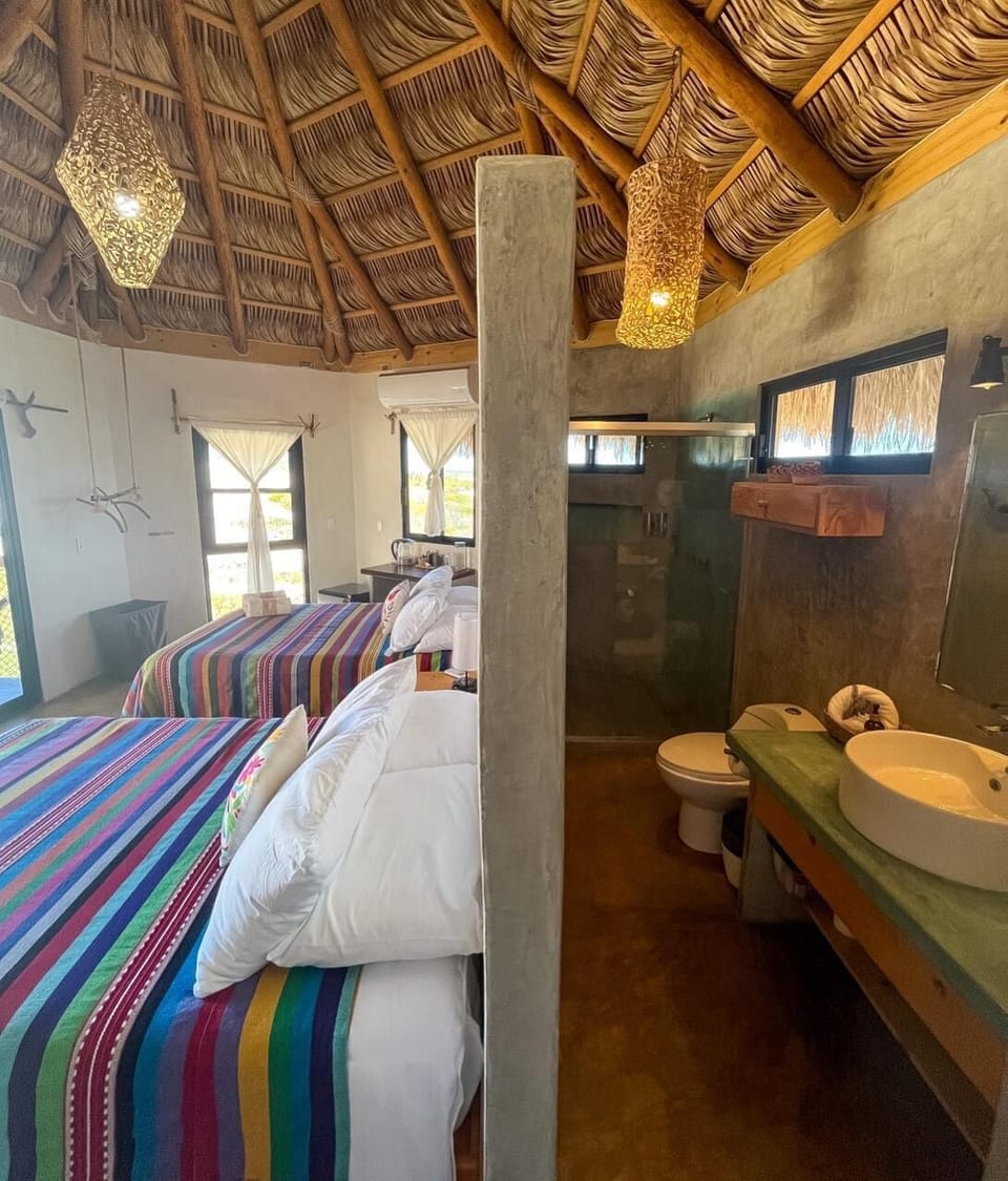 Basic Quadruple Room, Balcony, Desert View | Bathroom | Shower, towels, soap, shampoo