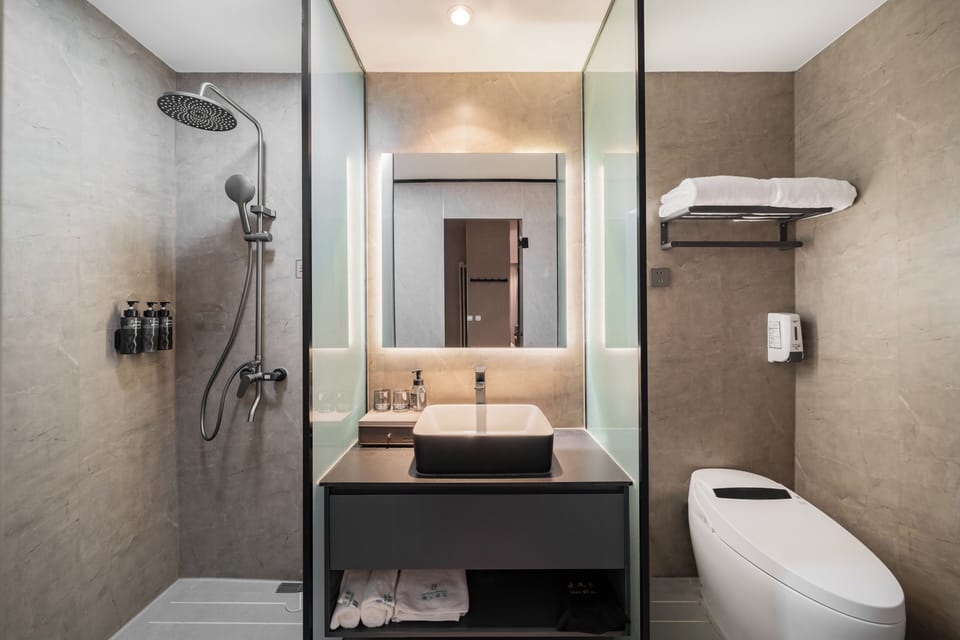 Shower, free toiletries, hair dryer, slippers