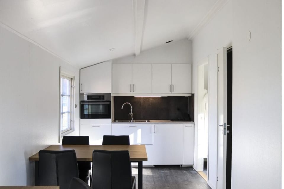 Cabin, 1 Bedroom | Private kitchen | Fridge, microwave, highchair, cookware/dishes/utensils