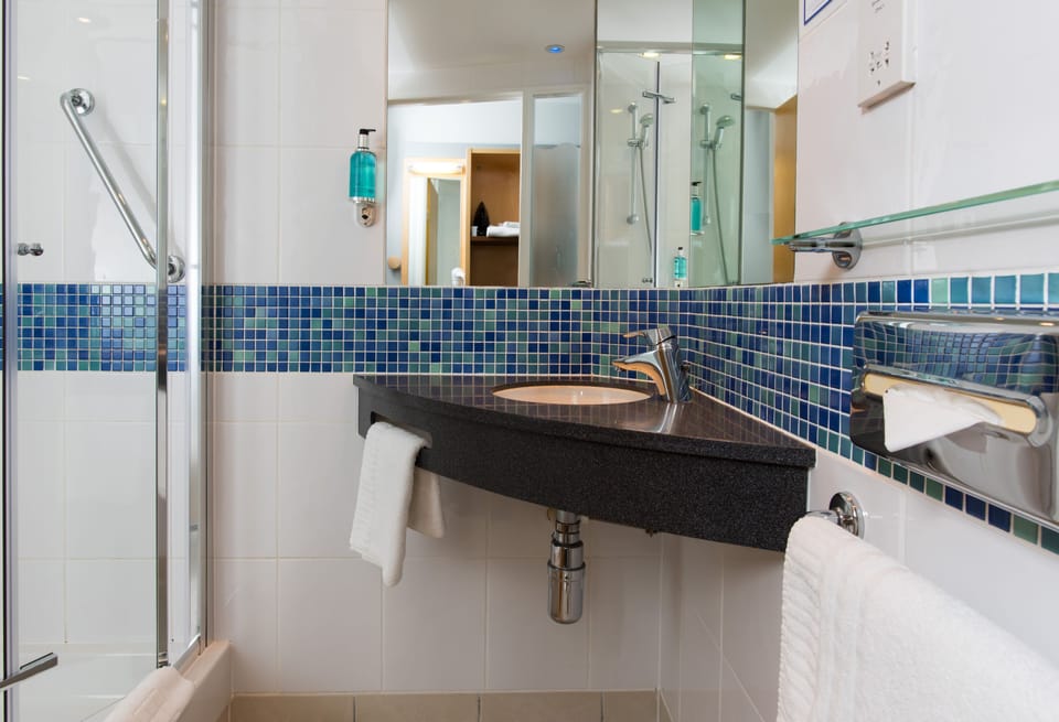 Shower, eco-friendly toiletries, hair dryer, towels