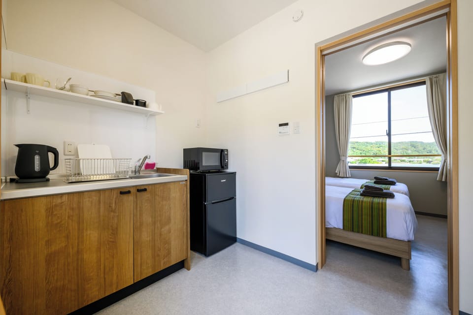 Apartment, Garden View | Private kitchen | Fridge, microwave, cookware/dishes/utensils