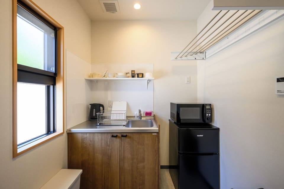 Apartment, Garden View | Private kitchen | Fridge, microwave, cookware/dishes/utensils