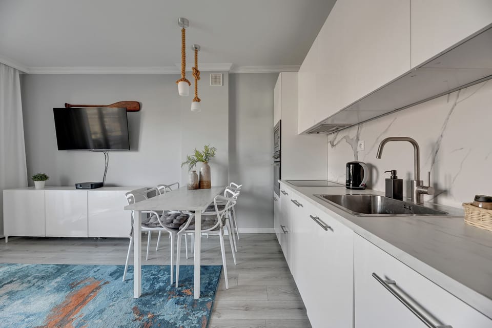 Family Apartment, City View | Private kitchen | Highchair, freezer, paper towels