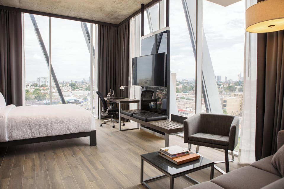Room, 1 King Bed, City View (Corner) | In-room safe, desk, iron/ironing board, free WiFi