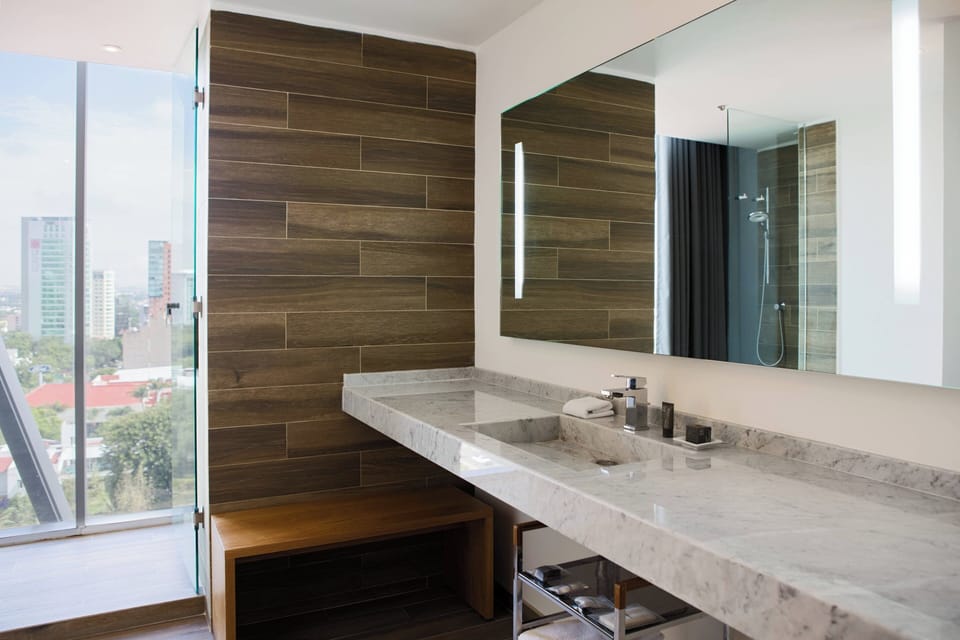 Junior Suite, 1 King Bed | Bathroom | Shower, free toiletries, hair dryer, towels