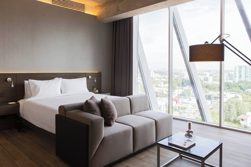 Junior Suite, 1 King Bed | In-room safe, desk, iron/ironing board, free WiFi
