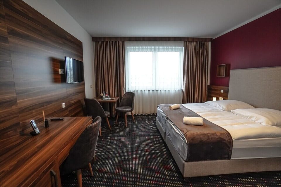 Deluxe Double Room | Desk, blackout drapes, iron/ironing board, free WiFi