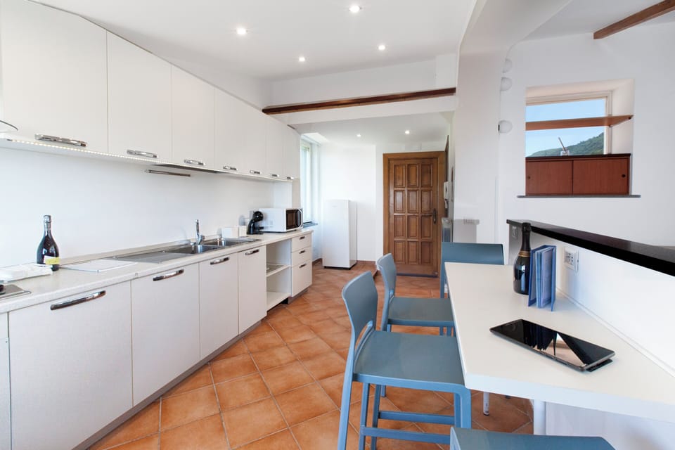 Penthouse, Partial Sea View | Private kitchen | Fridge, microwave, stovetop, espresso maker