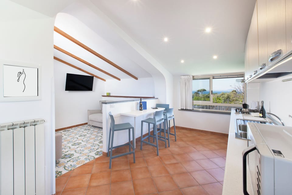 Penthouse, Partial Sea View | Private kitchen | Fridge, microwave, stovetop, espresso maker