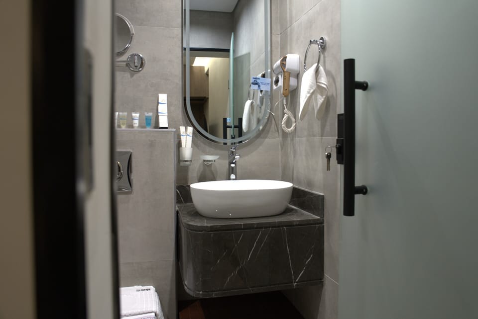 Hair dryer, towels, soap, shampoo