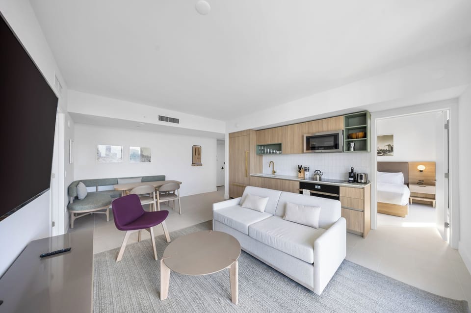 Condo, Balcony, City View | Living area | 36-inch Smart TV with cable channels