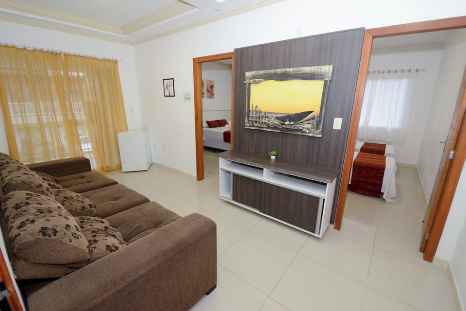 Deluxe Apartment, 2 Bedrooms, Balcony | Living room | 32-inch TV with digital channels