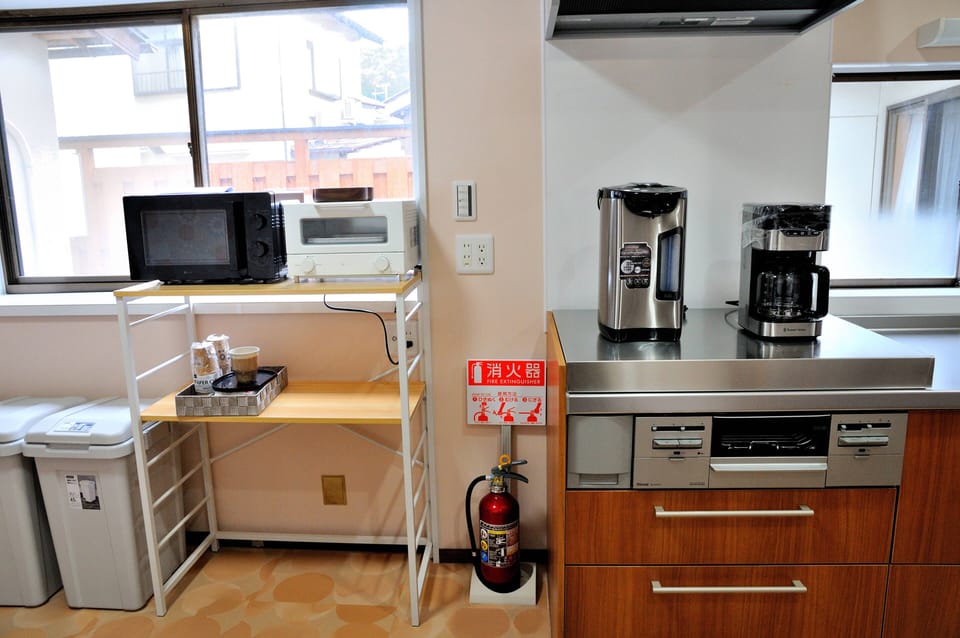 Full-size fridge, microwave, oven, paper towels