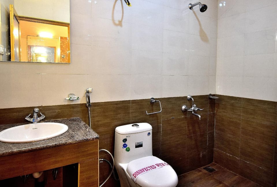 Shower, rainfall showerhead, towels, soap