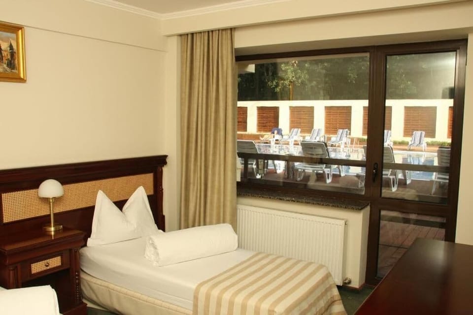 Double or Twin Room, Balcony, Garden View | Iron/ironing board, free WiFi