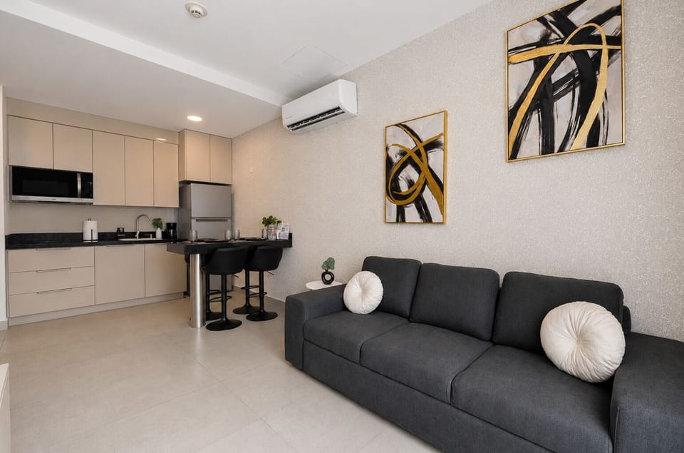 Business Suite, City View | Living area | 50-inch Smart TV with digital channels, streaming services