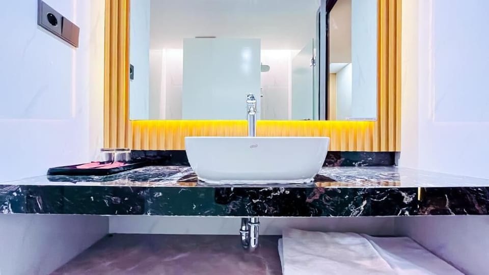 Family Suite, Balcony, Mountain View | Bathroom | Slippers, bidet, towels, soap