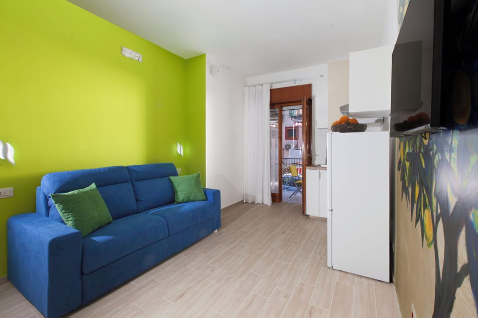 Apartment, 2 Bedrooms, Balcony | Living area | 32-inch flat-screen TV with digital channels