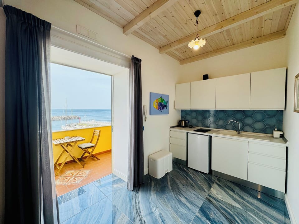 Apartment, Balcony, Sea View | Private kitchen | Fridge, electric kettle, cookware/dishes/utensils