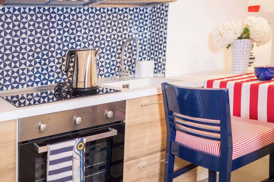 Deluxe Apartment, 4 Bedrooms, City View | Private kitchen | Oven, stovetop, espresso maker, electric kettle